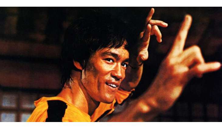 African youth came into field to be Bruce Lee