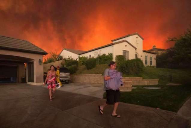 Raging wildfire engulfs California homes, film set