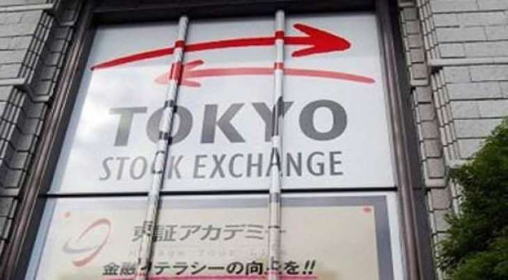 Tokyo stocks end higher on massive Japan stimulus