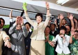 New Tokyo governor says defying party secured win