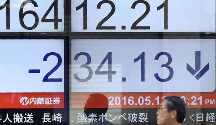 Tokyo stocks down by break as strong yen hits exporters