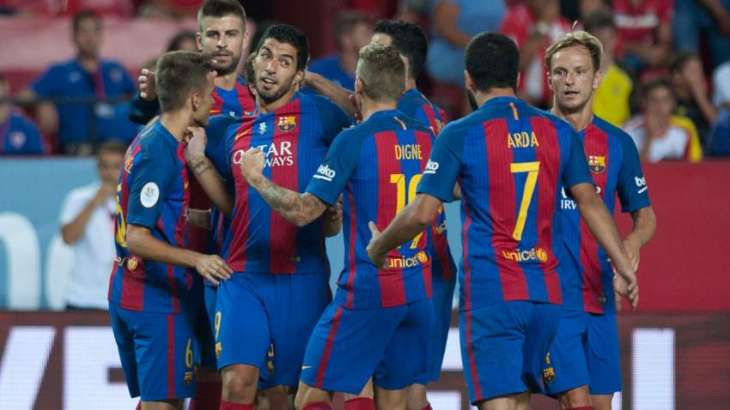 Football: Suarez gives Barcelona edge in Supercup