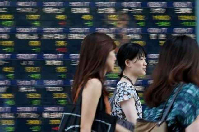 Most Asia markets slump, Tokyo soars on US rate talk