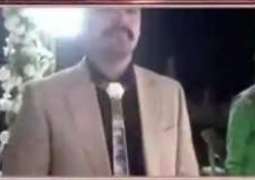 Man wears gold tie, shoes on wedding