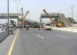 Trailer hits overhead bridge in Lahore