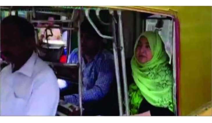 Woman candidate from NA-170 running election campaign on rickshaw