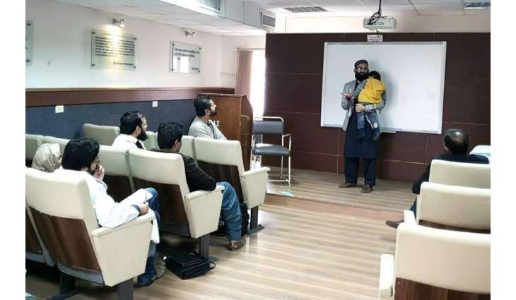 Breaking stereotypes: Gold medalist Zaman Khan delivers lecture while holding son