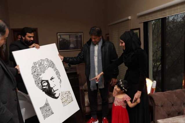 Sketch artist Sonia meets PM Imran, presents him his calligraphy portrait