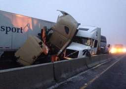 8 killed, more than dozen injured in head on collision between truck and passenger van