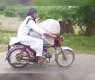 Only in Pakistan! Watch man riding bike with a cow
