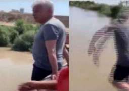 Beating the heat – Khawaja Asif spotted diving in canal