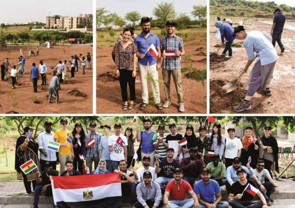 Foreign students join plantation drive at NUST