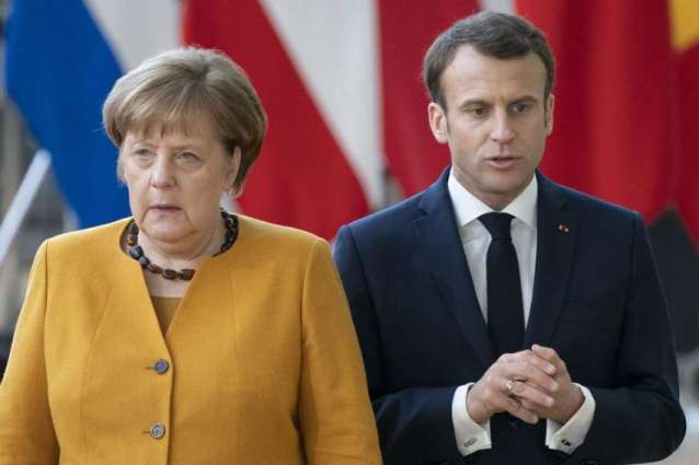 Macron, Merkel to Brief EU Leaders on Implementation of Minsk Accords on Thursday - Source
