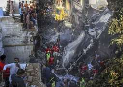 97 killed as plane crashes into residential area near Karachi airport
