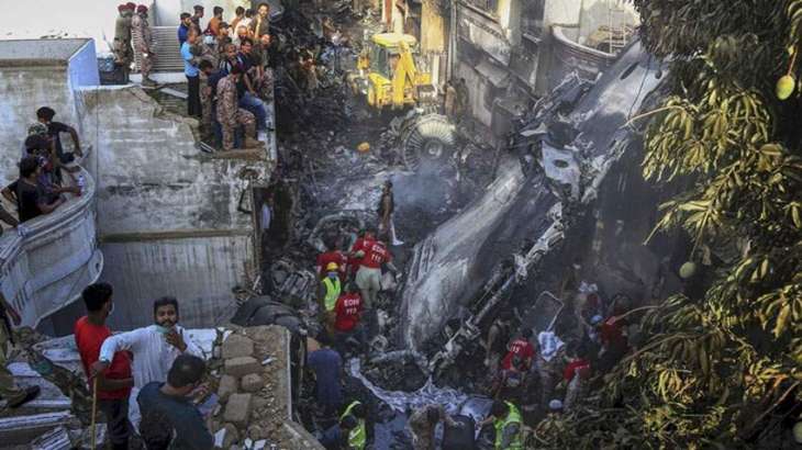 97 killed as plane crashes into residential area near Karachi airport