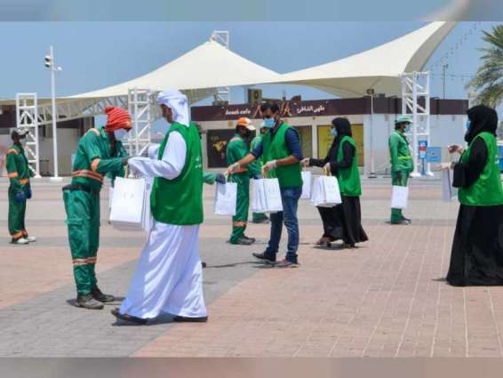 Abu Dhabi City Municipality providing water, juices, umbrellas to outdoor workers