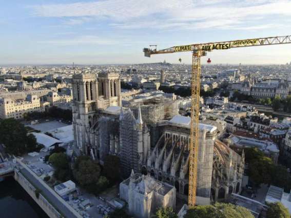 Greenpeace Activists Hang Climate Change Banner Over Notre Dame to Protest Gov't Inaction