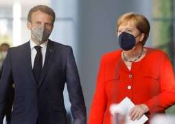 Merkel, Macron Want EU to Consider Inviting Putin to Summit - Reports