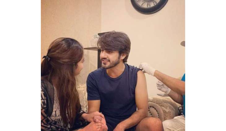 Ahsan Mohsin, supported by Minal Khan, gets COVID jab