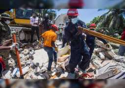 Haiti hospitals overwhelmed by quake victims as death toll hits 1,297