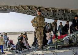 Evacuations from Afghanistan gather momentum as Taliban promise peace