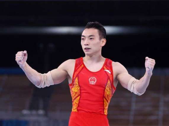 Chinese Gymnast Zou Wins Olympic Gold in Parallel Bars Competition at Tokyo Games