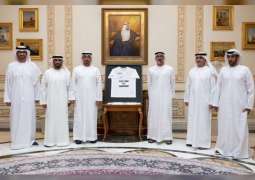 Mohamed bin Zayed receives official t-shirt of 3rd ADNOC Abu Dhabi Marathon