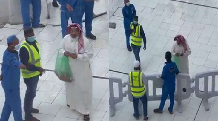 مقطع : سعودي یوزّع مبالغ مالیة علی عاملي الحرم المکي بعد تخفیف الاجراء ات الاحترازیة