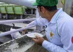 Pakistan’s Test batsman Abid Ali shares his lunch with cat