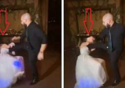 شاھد مقطع : عریس یرکل عروسہ فی وجھھا أثناء حفل زفافھما فی لندن