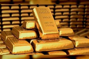 الذهب يوسع مكاسبه إلى 30 دولار ا بعد رفع الفائدة الأمريكية