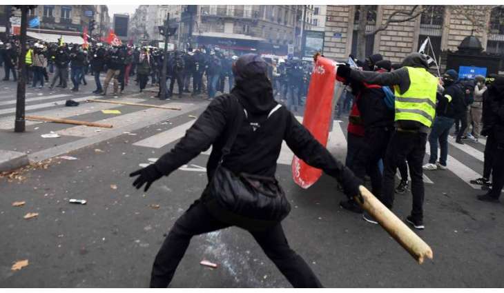 Police Now Using Tear Gas During Protest Against Pension Reform in Paris