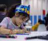 Young artists create personalised anime accessory bags at SCRF 2023