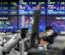 Stock markets mixed as traders eye high interest rates for longer