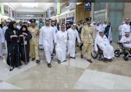 Mansoor bin Mohammed leads celebratory march at DWTC on the occasion of International White Cane Day