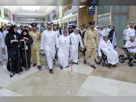 Mansoor bin Mohammed leads celebratory march at DWTC on the occasion of International White Cane Day