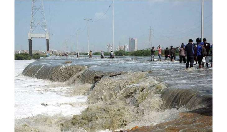 Karachi rains trigger flooding; Shahrah-e-Bhutto washed away, Thado Dam overflows