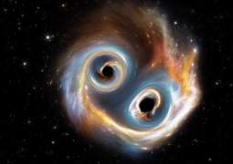 Astronomers capture first-ever image of two black holes orbiting each other