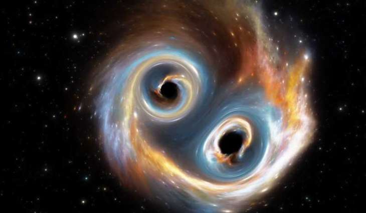 Astronomers capture first-ever image of two black holes orbiting each other