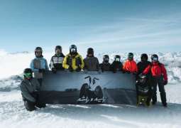 UAE flag, portrait of Zayed and Rashid unfurled atop Alps as part of Eid Al Etihad celebrations
