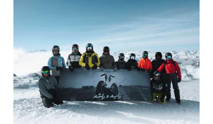 UAE flag, portrait of Zayed and Rashid unfurled atop Alps as part of Eid Al Etihad celebrations