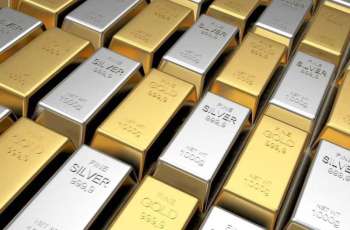 Gold falls as dollar holds firm on Fed rate-hike expectations