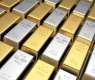 Gold falls as dollar holds firm on Fed rate-hike expectations