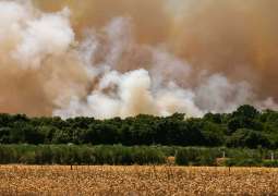 10,000 evacuated as wildfires spread in France