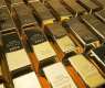 Gold prices fall as precious metals trade mixed